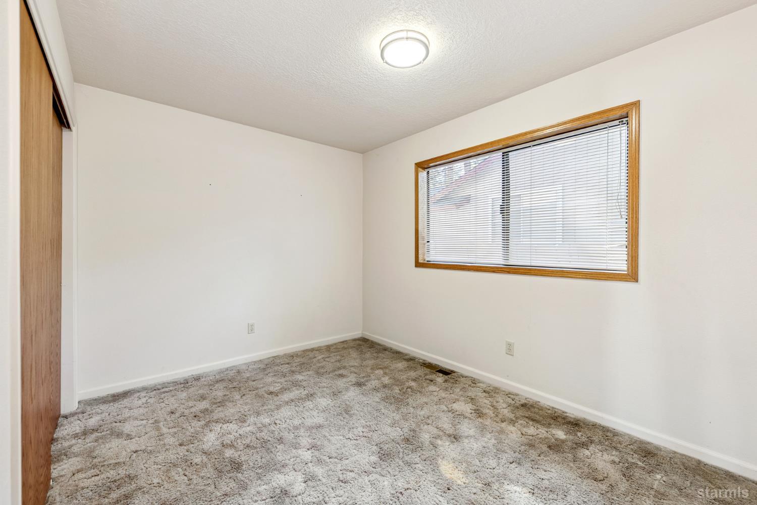 2699 Elwood Avenue South Lake Tahoe, CA 96150 - Photo 16 of 27 an empty room with a window