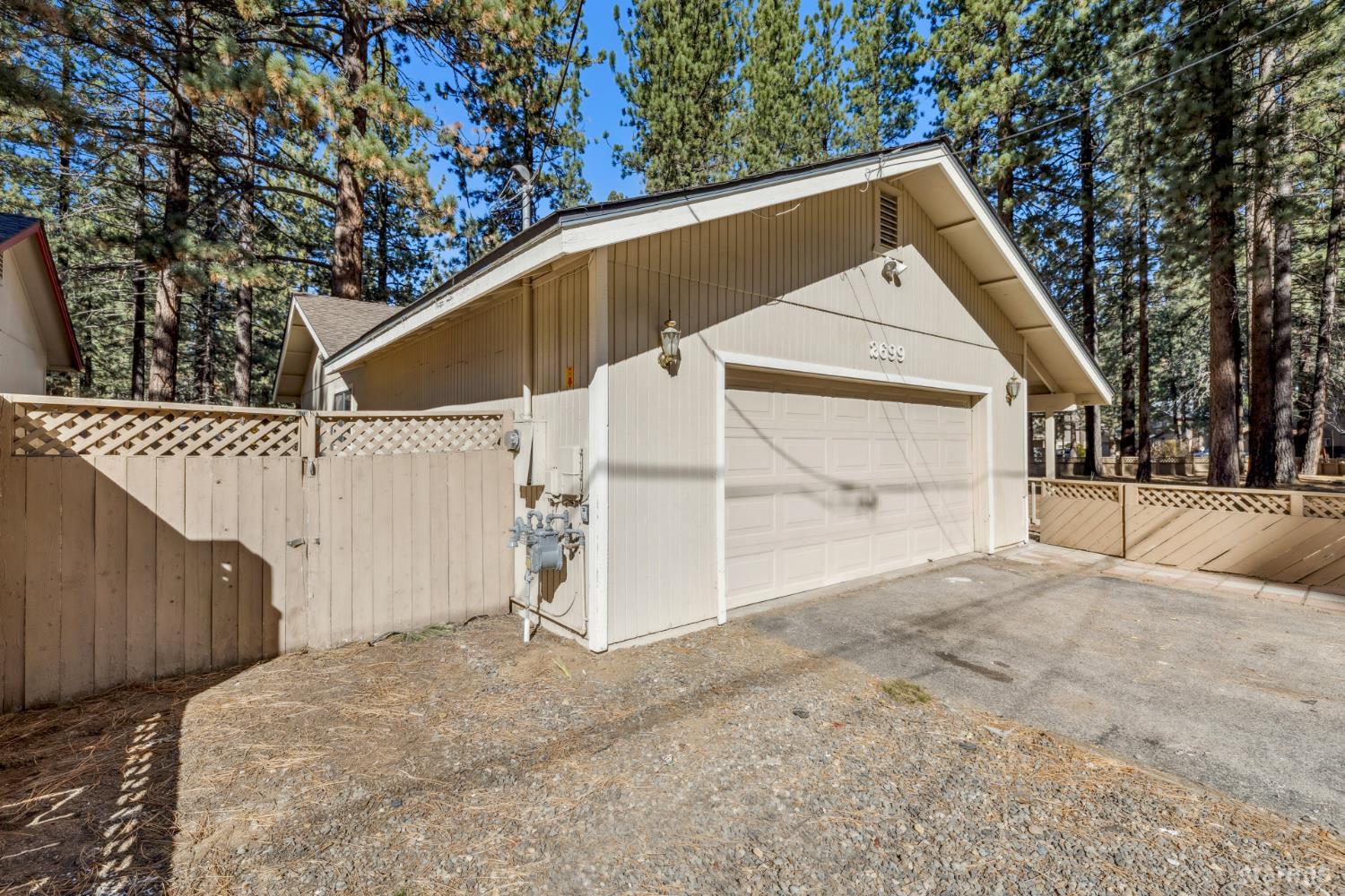 2699 Elwood Avenue South Lake Tahoe, CA 96150 - Photo 20 of 27 a view of a house with a yard