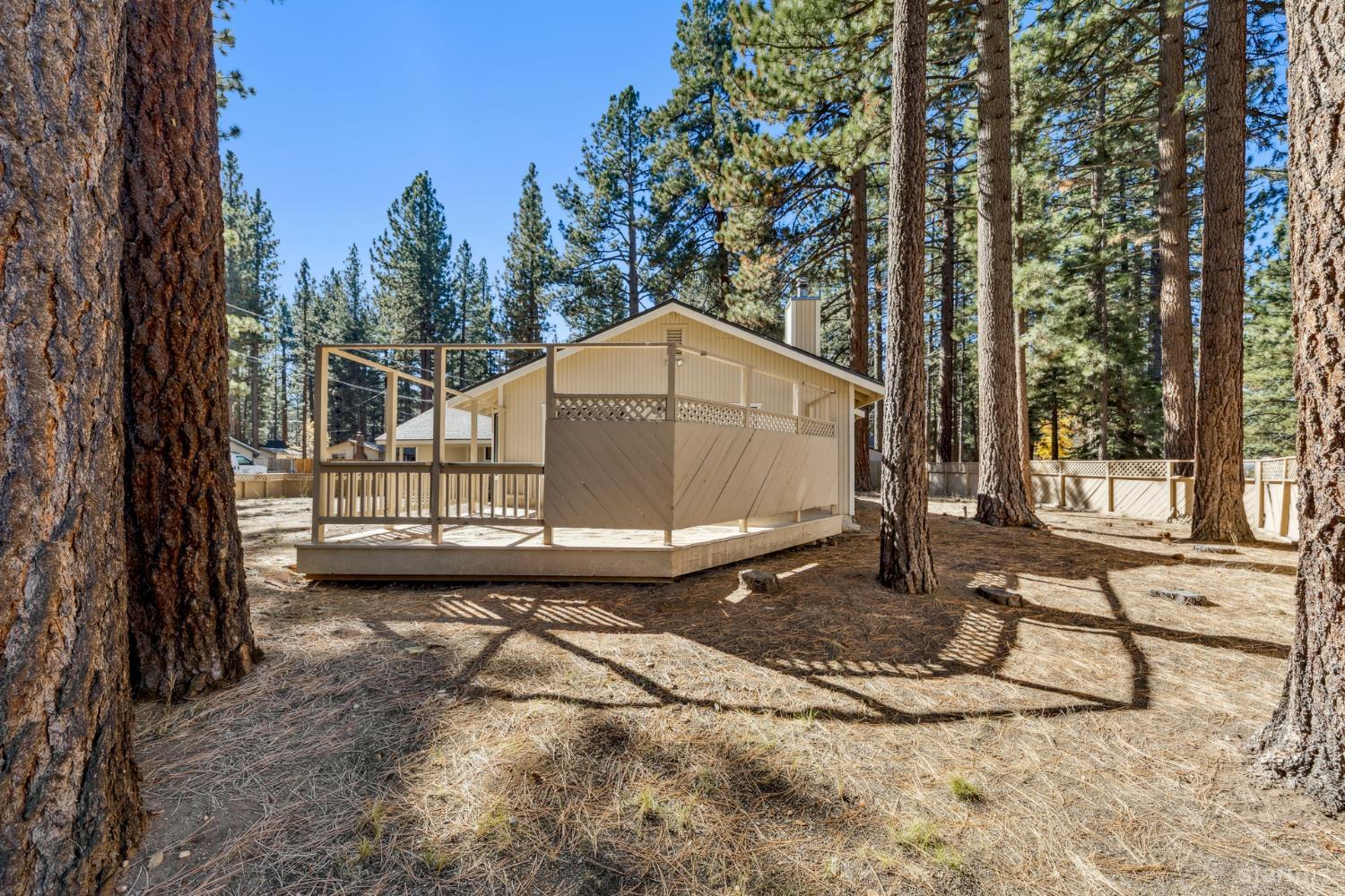 2699 Elwood Avenue South Lake Tahoe, CA 96150 - Photo 24 of 27 a backyard of a house with a yard and seating space