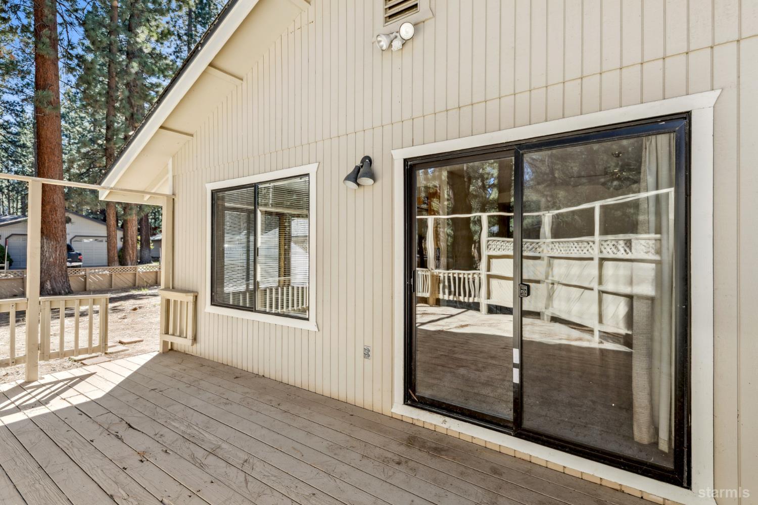 2699 Elwood Avenue South Lake Tahoe, CA 96150 - Photo 26 of 27 an outdoor view of porch with wooden floor and floor to ceiling window
