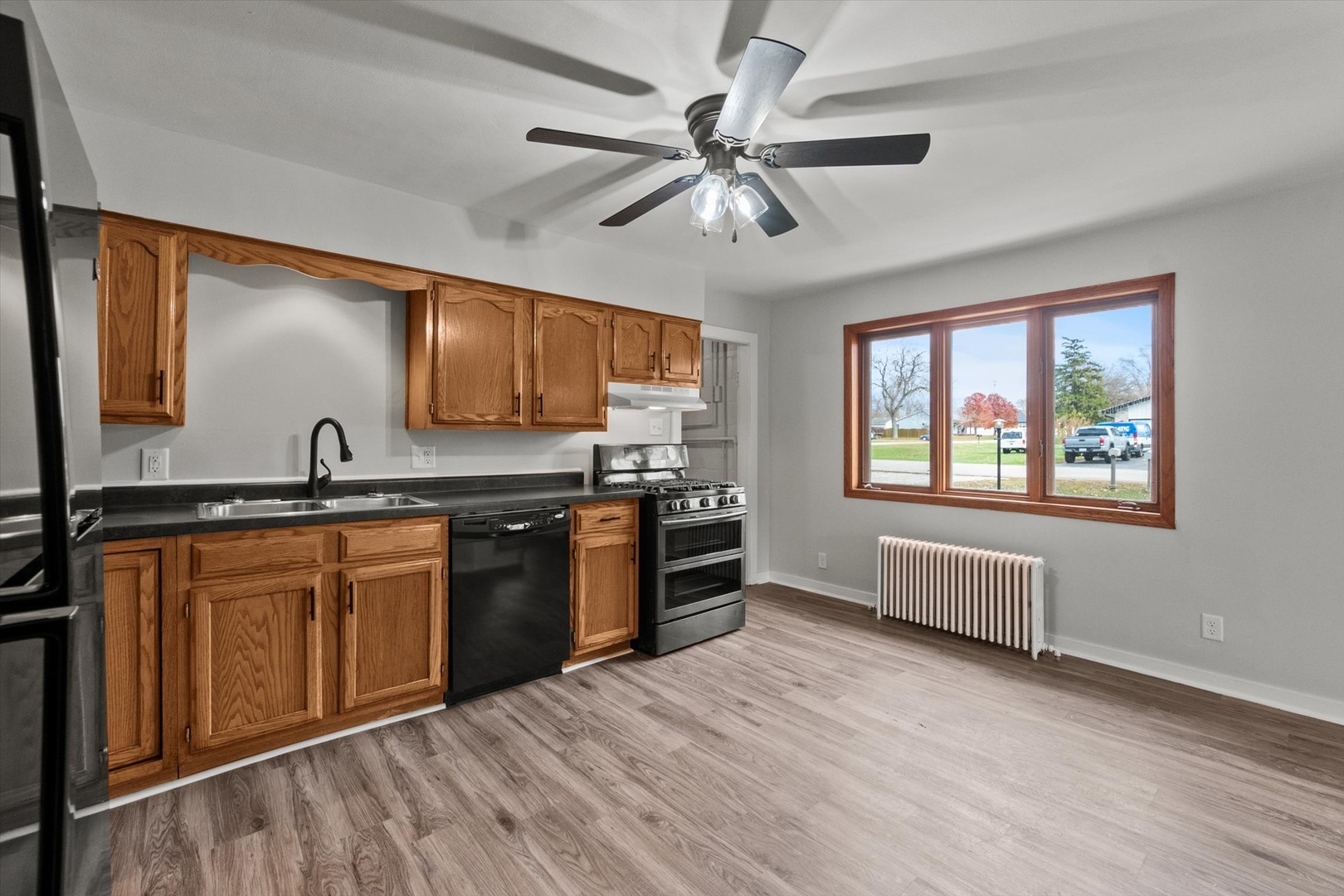 913 Ogden Road New Lenox, IL 60451 - Photo 12 of 41 a large kitchen with stainless steel appliances granite countertop a stove a sink and a refrigerator