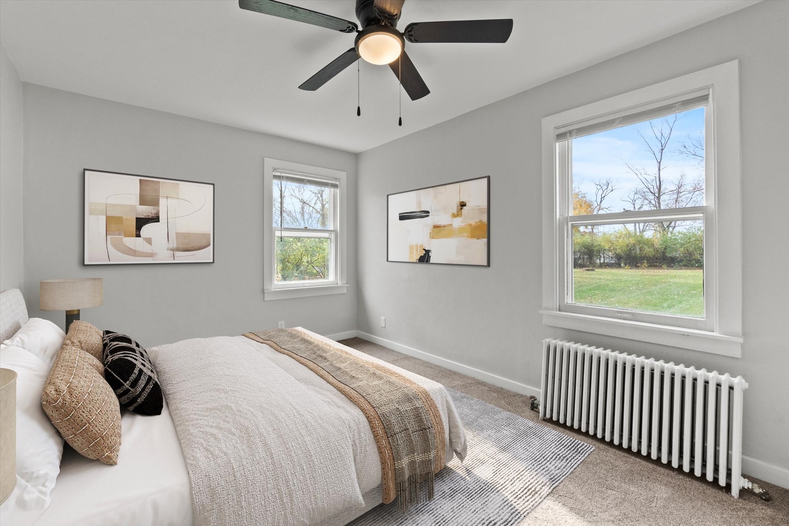 913 Ogden Road New Lenox, IL 60451 - Photo 15 of 41 a bedroom with a bed and a chandelier