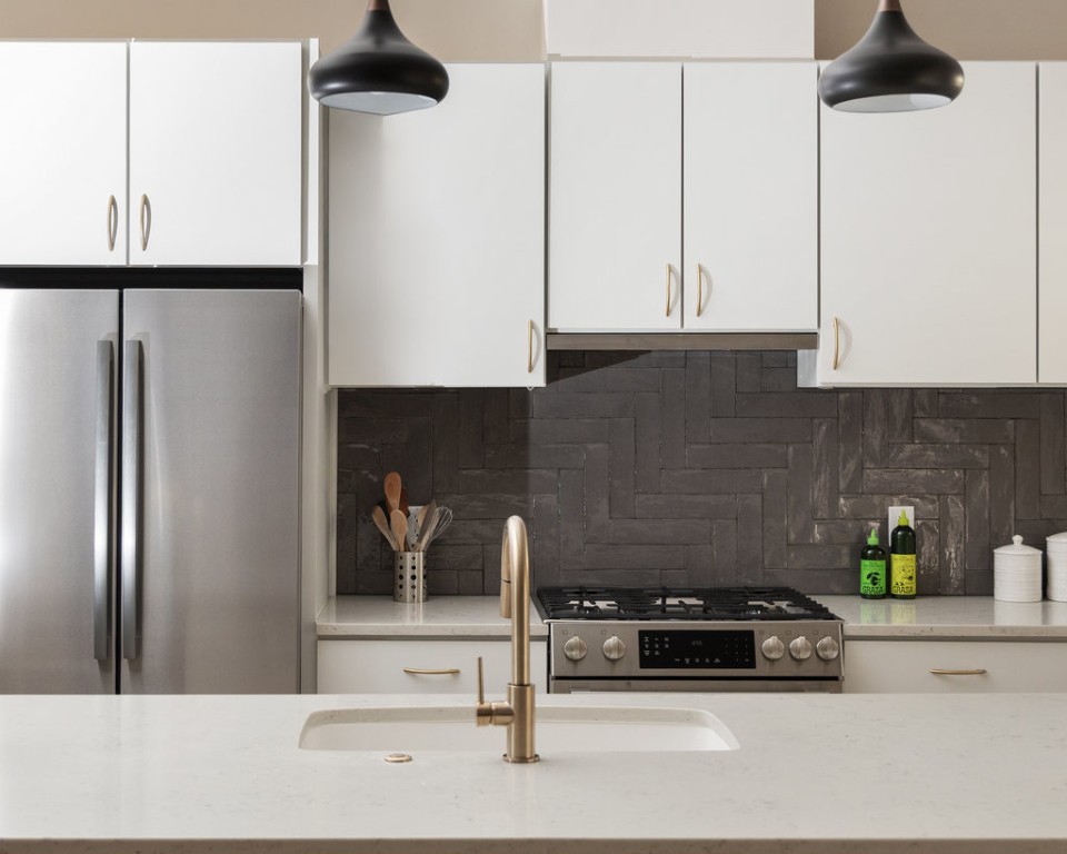 2300 Enfield Road, Unit 303 Austin, TX 78703 - Photo 15 of 38 a kitchen with a refrigerator and a stove