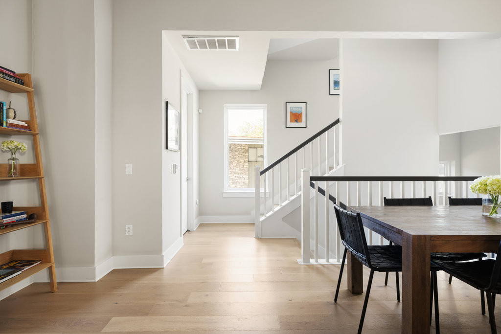 2300 Enfield Road, Unit 303 Austin, TX 78703 - Photo 23 of 38 a view of a hallway with wooden floor and stairs