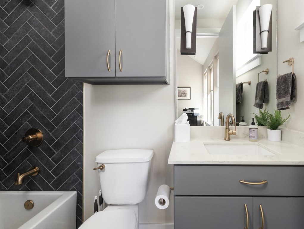 2300 Enfield Road, Unit 303 Austin, TX 78703 - Photo 33 of 38 a bathroom with a sink a toilet and shower