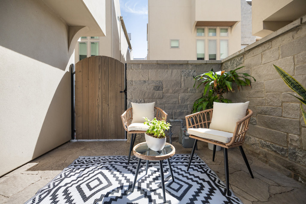 2300 Enfield Road, Unit 303 Austin, TX 78703 - Photo 6 of 38 a balcony with furniture and a potted plant