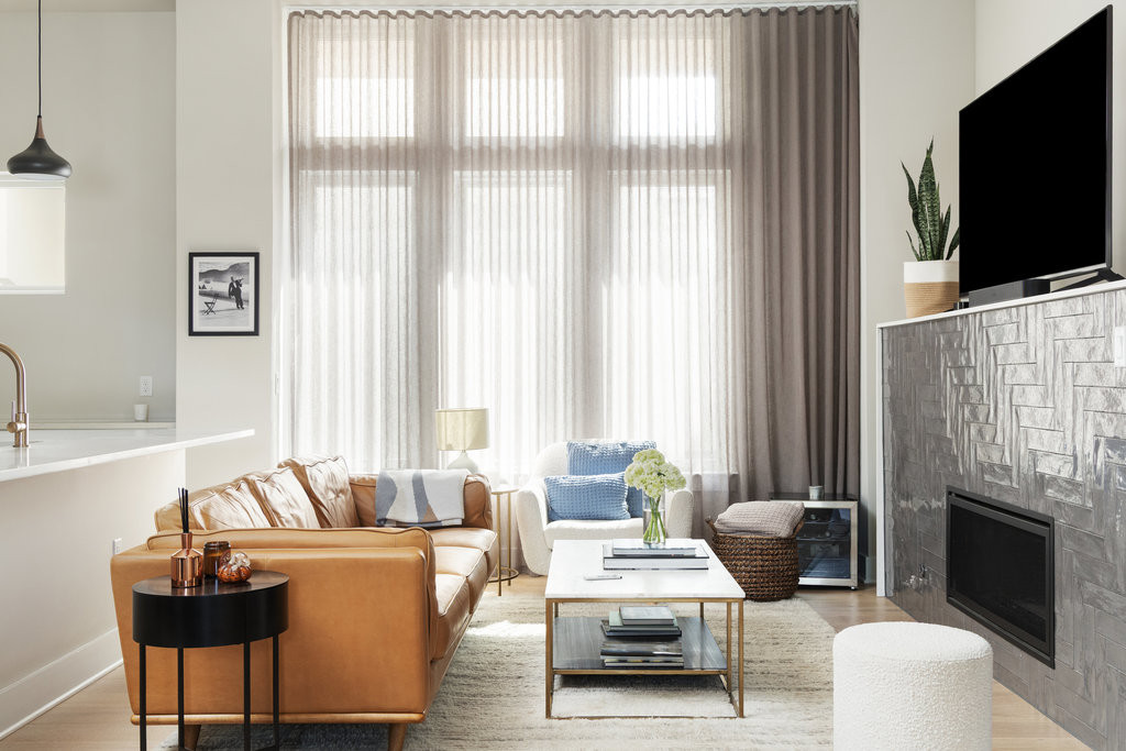 2300 Enfield Road, Unit 303 Austin, TX 78703 - Photo 8 of 38 a living room with furniture a fireplace and a flat screen tv