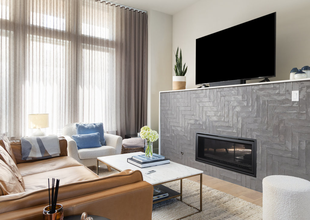 2300 Enfield Road, Unit 303 Austin, TX 78703 - Photo 9 of 38 a living room with furniture a flat screen tv and a fireplace