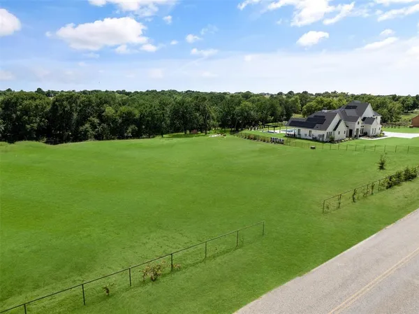 a view of a golf course with a garden