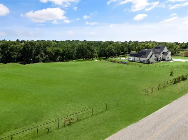 a view of a golf course with a garden