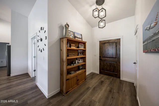 a kitchen with granite countertop stainless steel appliances and wooden cabinets