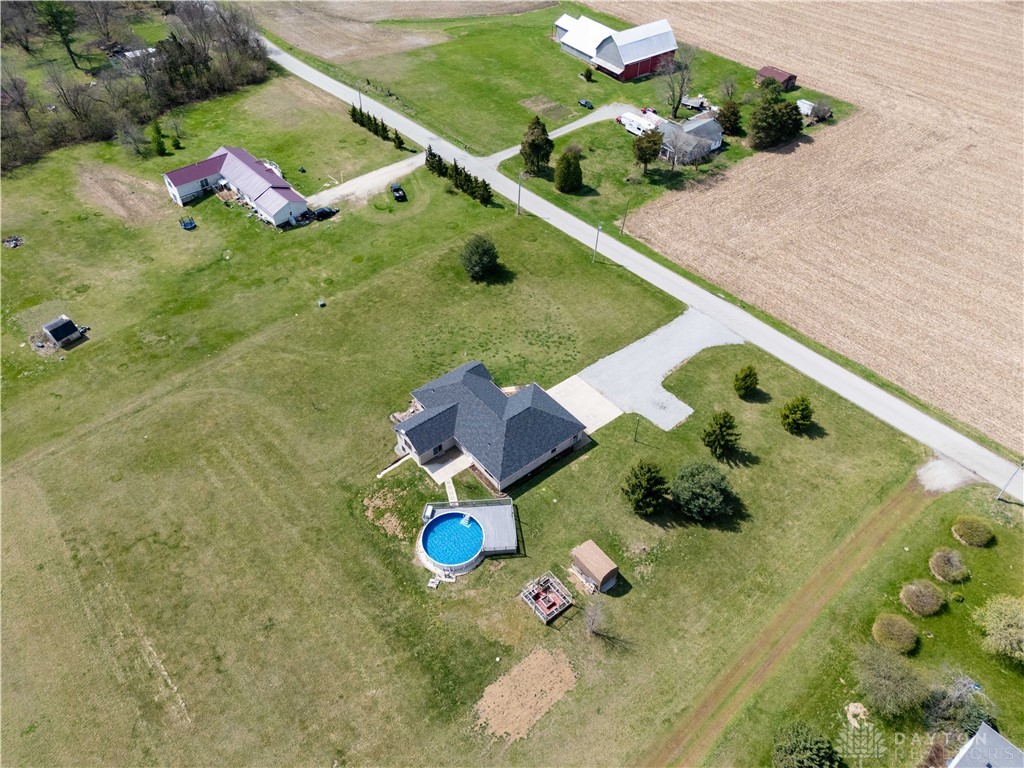 5264 Frazier-Guy Road Sidney, OH 45365 - Photo 49 of 51 This expansive property offers a private pool and outbuildings amidst vast open spaces.