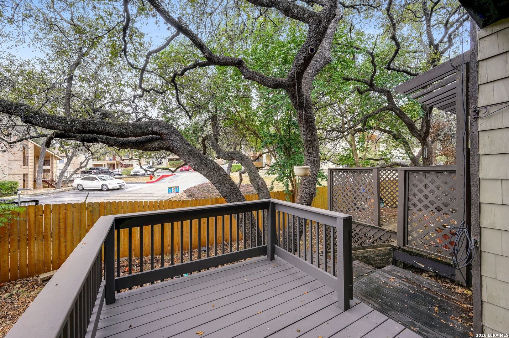 11815 Vance Jackson Road, Unit 1402 San Antonio, TX 78230 - Photo 13 of 29 a view of balcony with wooden floor and fence