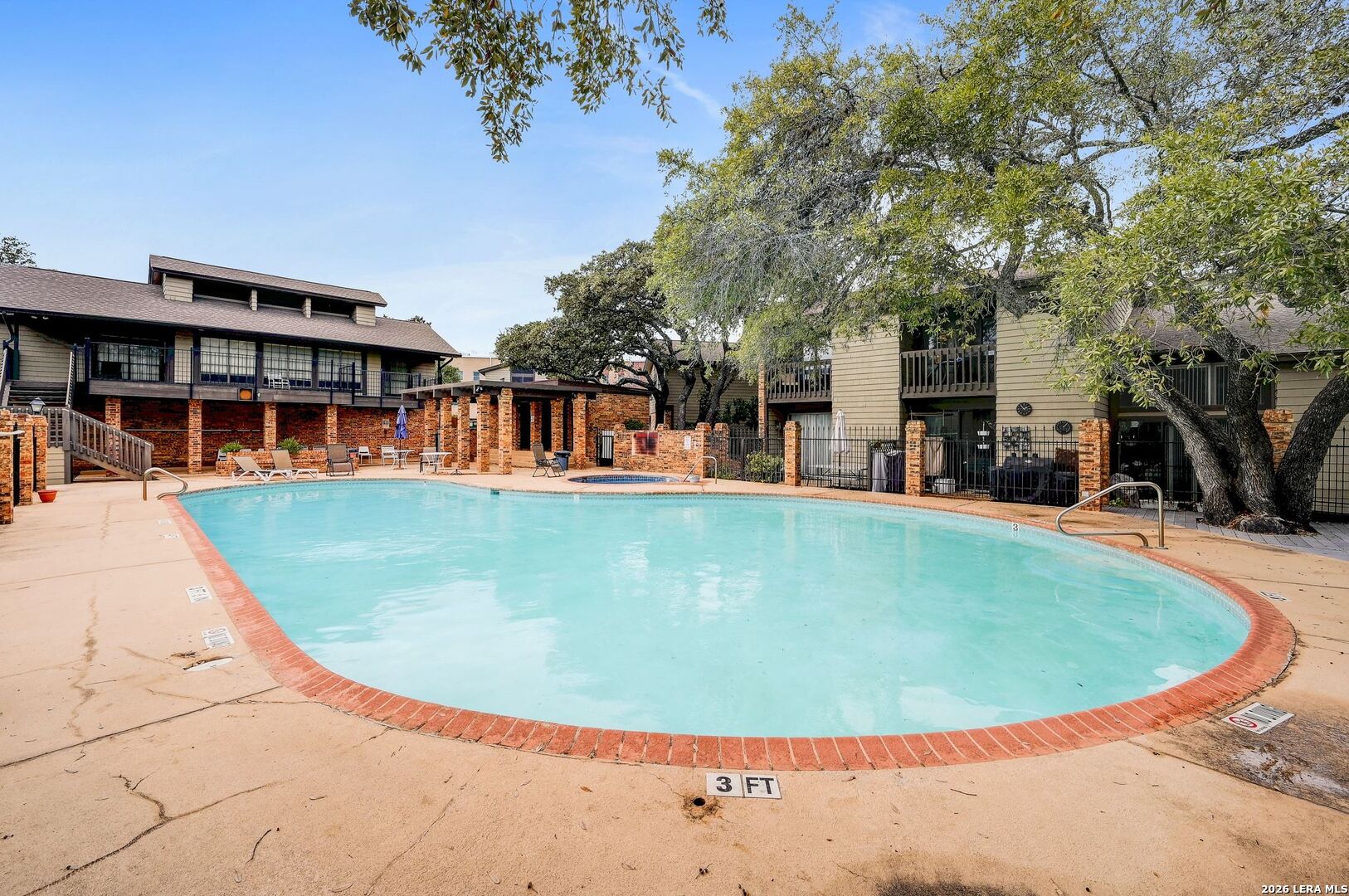 11815 Vance Jackson Road, Unit 1402 San Antonio, TX 78230 - Photo 23 of 29 a view of a swimming pool with an outdoor seating