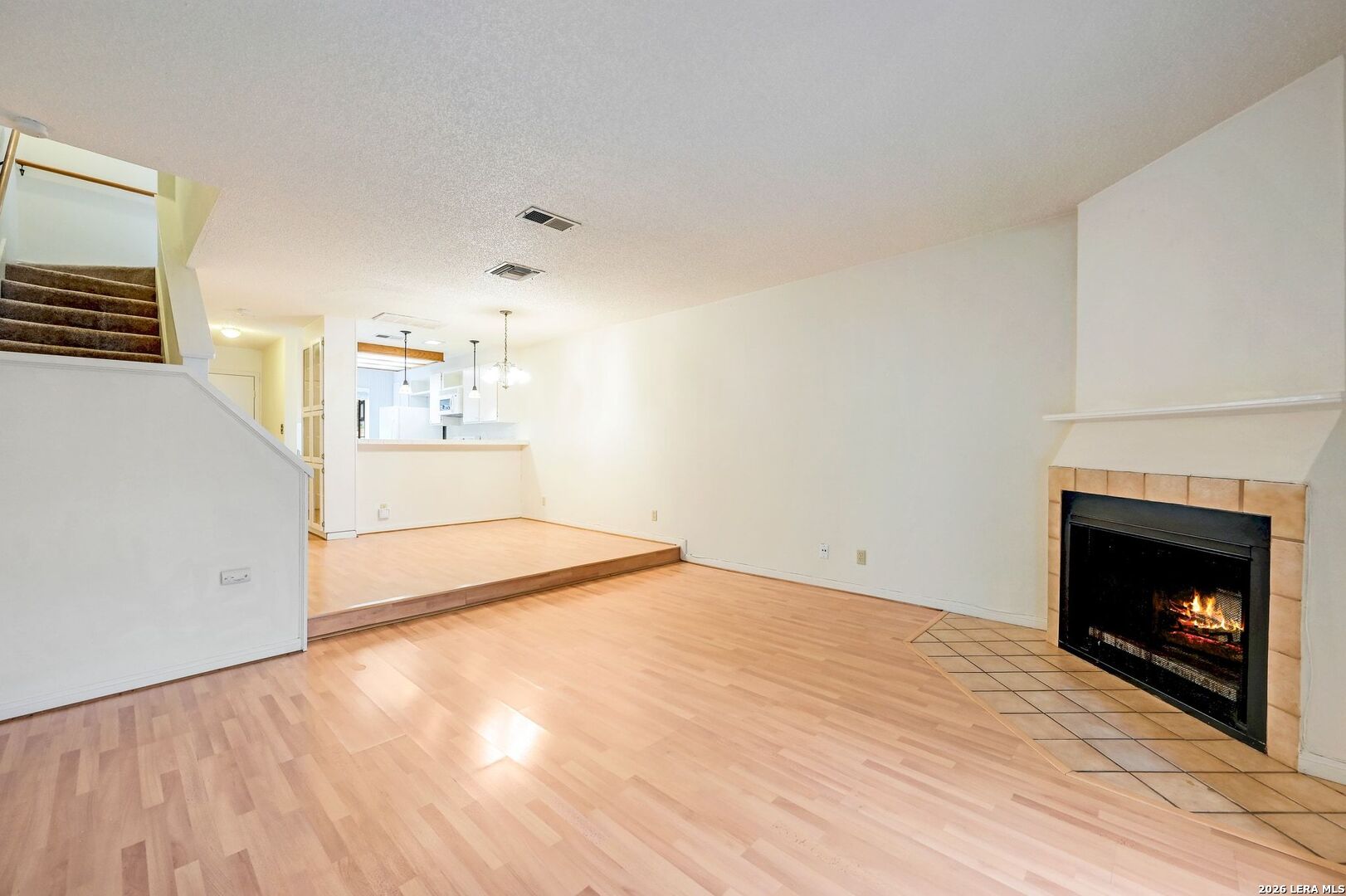 11815 Vance Jackson Road, Unit 1402 San Antonio, TX 78230 - Photo 7 of 29 a bedroom with a bed and a fireplace