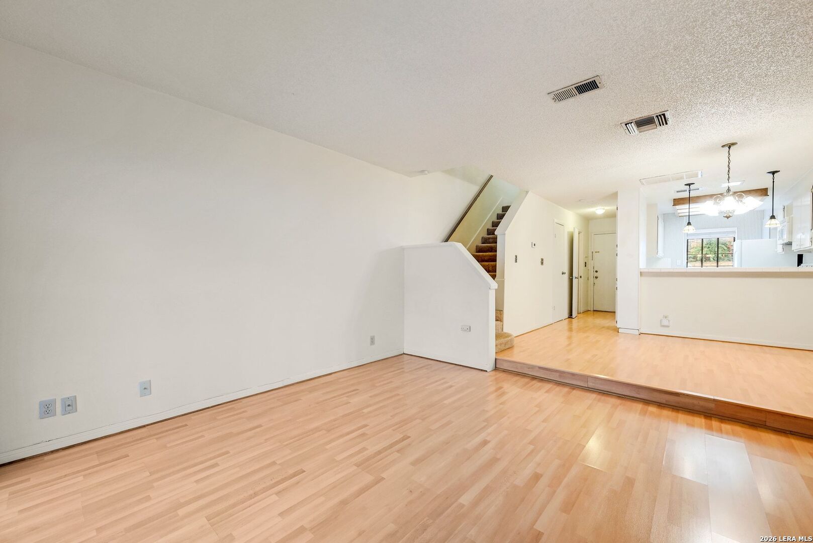 11815 Vance Jackson Road, Unit 1402 San Antonio, TX 78230 - Photo 10 of 29 a view of a room with wooden floor