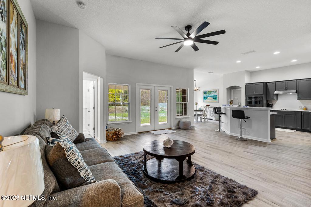 54150 Deerfield Country Club Road Callahan, FL 32011 - Photo 11 of 37 a living room with furniture and a large window