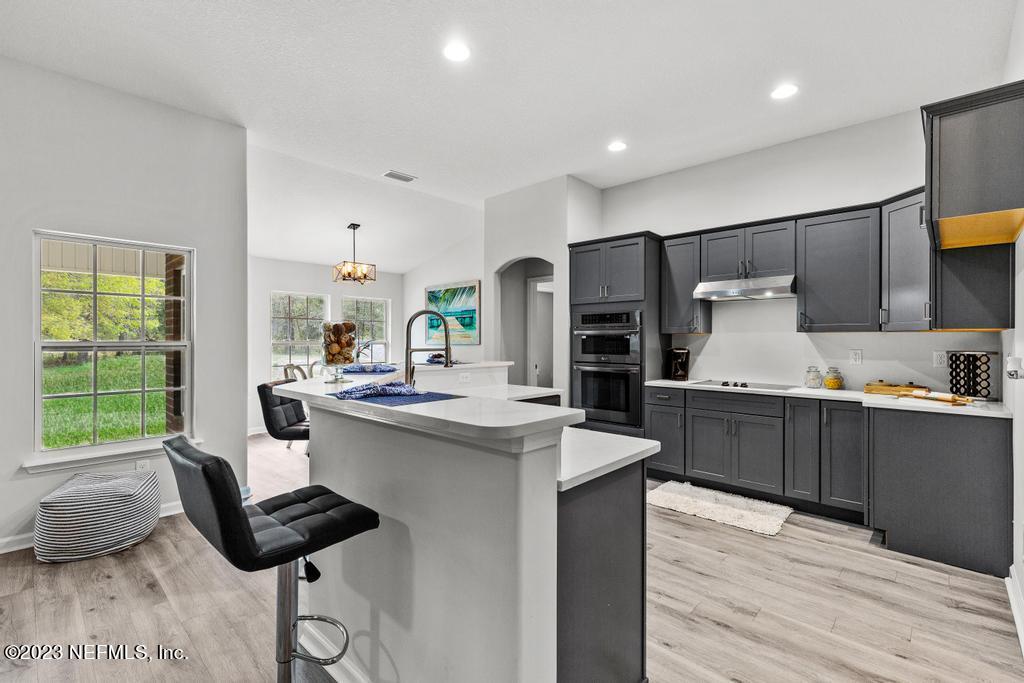 54150 Deerfield Country Club Road Callahan, FL 32011 - Photo 14 of 37 a kitchen with counter space cabinets and appliances