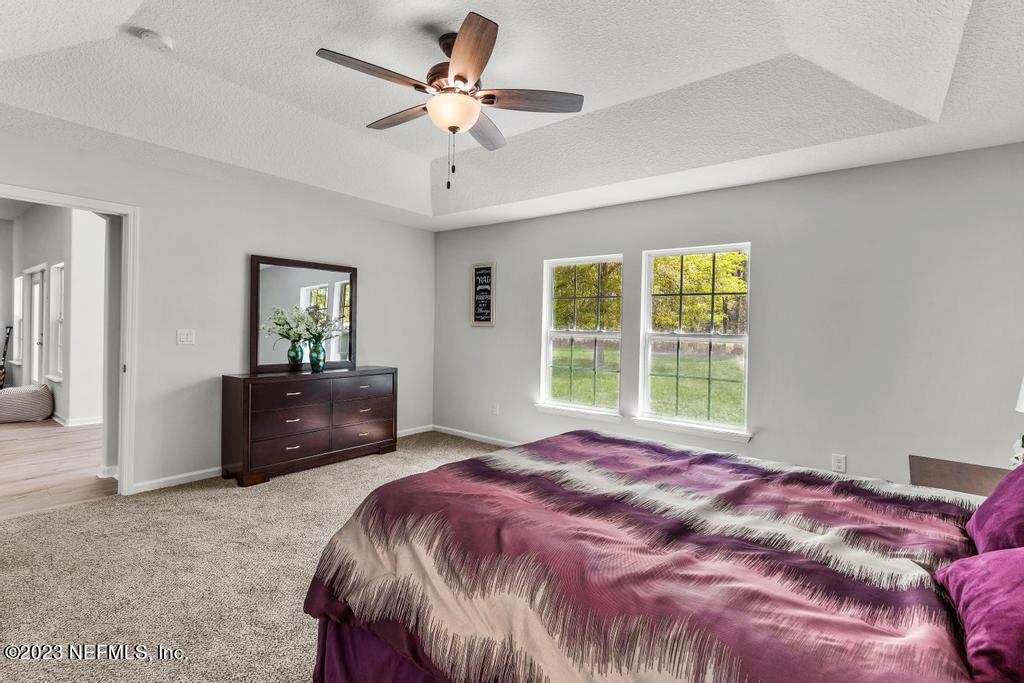 54150 Deerfield Country Club Road Callahan, FL 32011 - Photo 22 of 37 a bedroom with a bed and a dresser