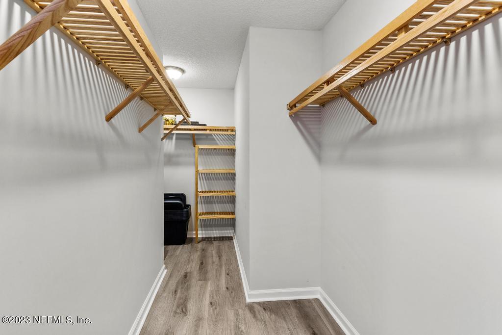54150 Deerfield Country Club Road Callahan, FL 32011 - Photo 29 of 37 a view of walk in closet with clothes