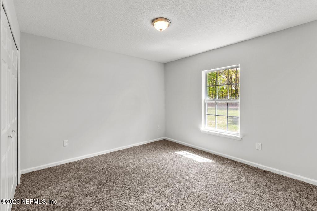 54150 Deerfield Country Club Road Callahan, FL 32011 - Photo 30 of 37 an empty room with a window