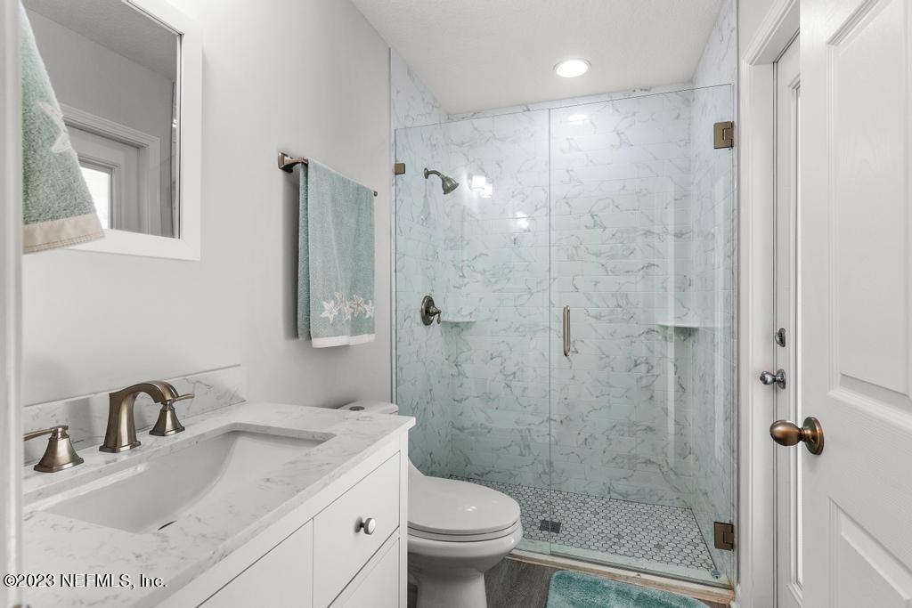 54150 Deerfield Country Club Road Callahan, FL 32011 - Photo 31 of 37 a bathroom with a sink toilet and shower