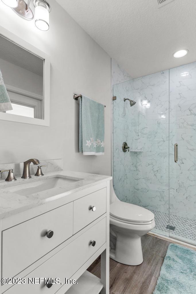 54150 Deerfield Country Club Road Callahan, FL 32011 - Photo 32 of 37 a bathroom with a sink a toilet and shower