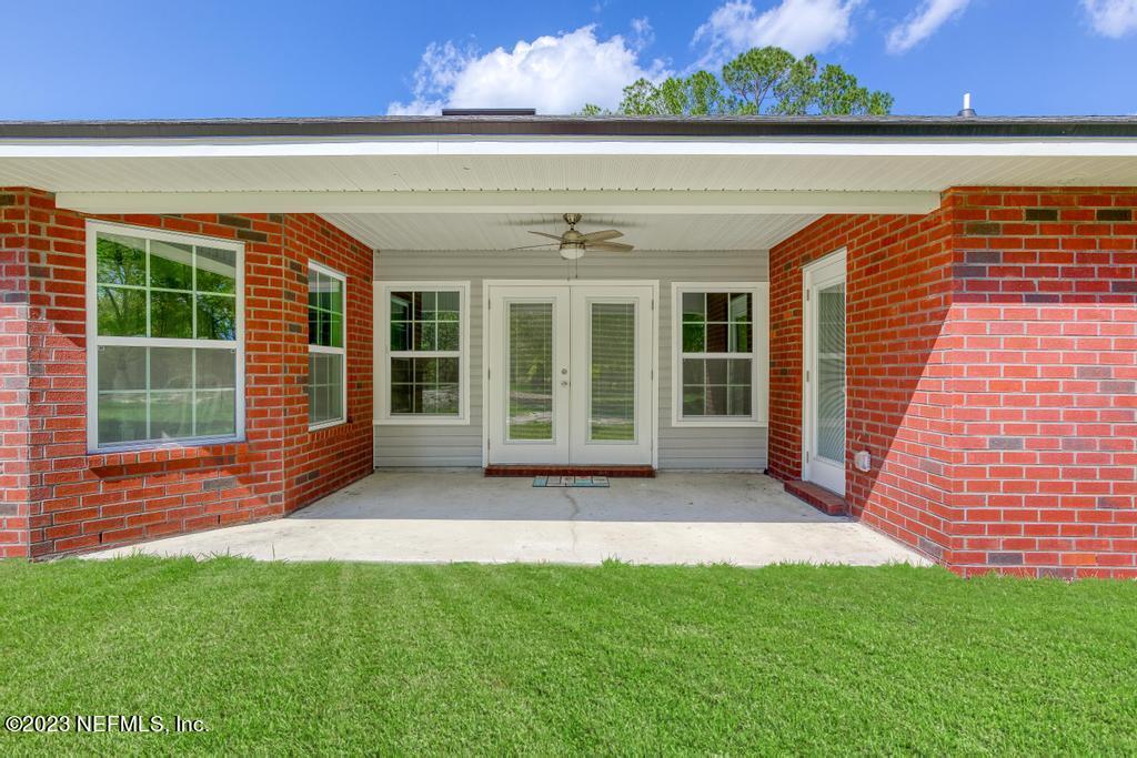54150 Deerfield Country Club Road Callahan, FL 32011 - Photo 35 of 37 a view of swimming pool with outdoor seating