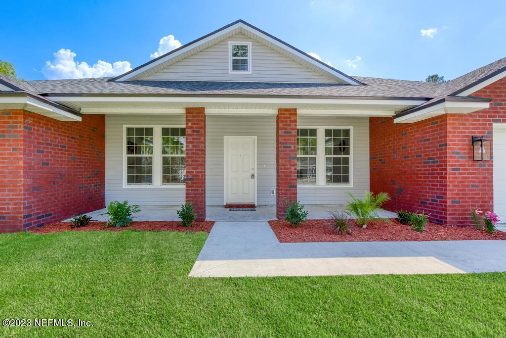 54150 Deerfield Country Club Road Callahan, FL 32011 - Photo 4 of 37 front view of a house with a yard