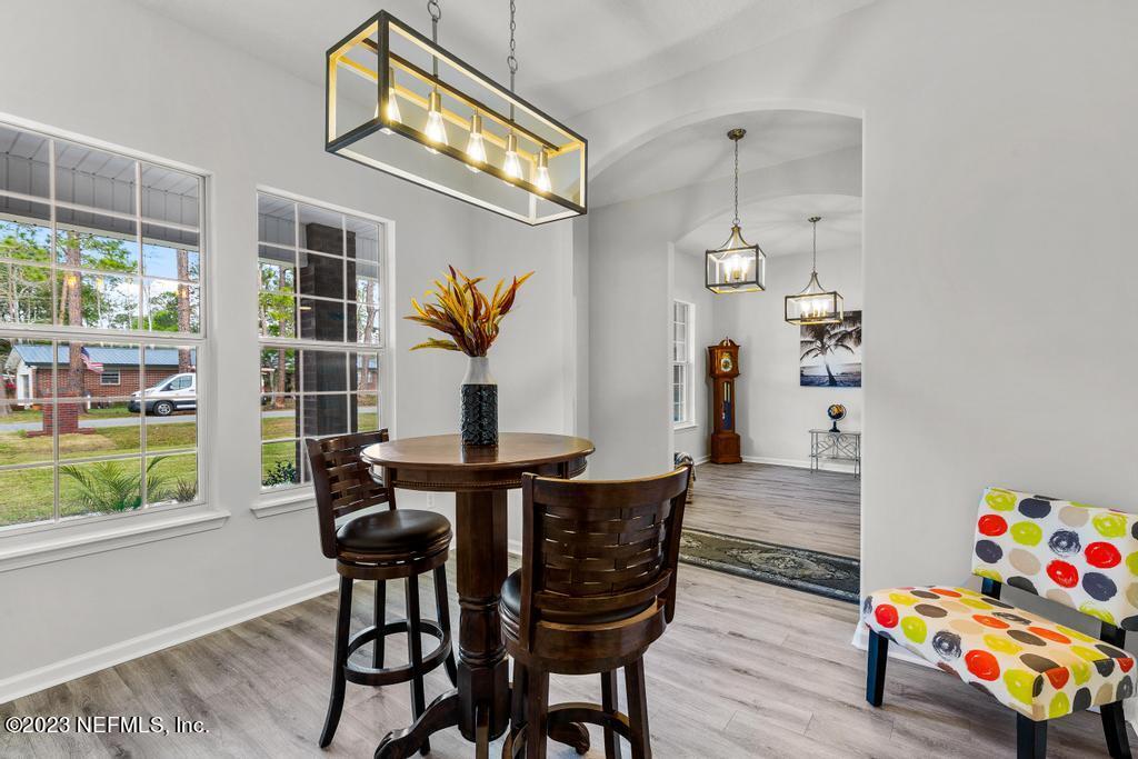 54150 Deerfield Country Club Road Callahan, FL 32011 - Photo 9 of 37 a view of a dining room with furniture and a window