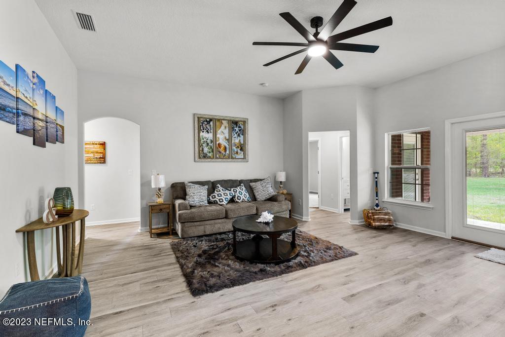 54150 Deerfield Country Club Road Callahan, FL 32011 - Photo 10 of 37 a living room with furniture and wooden floor