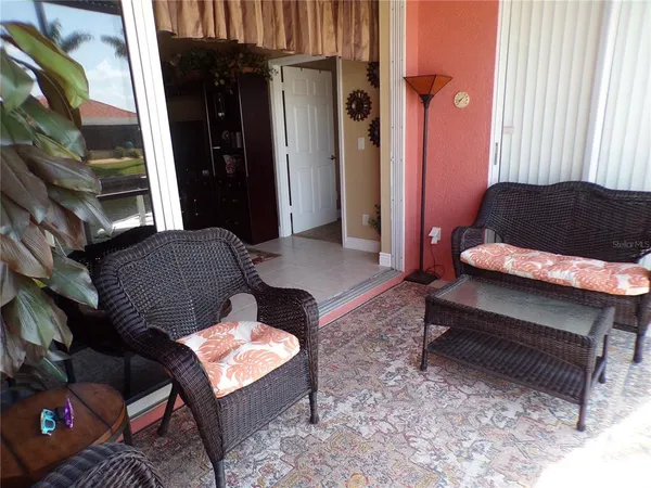 a view of living room filled with furniture and window
