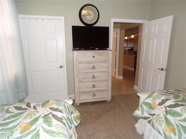 a bedroom with bed and window