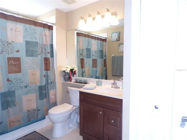 a lobby with furniture and a potted plant