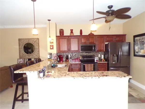 a living room with furniture and a painting