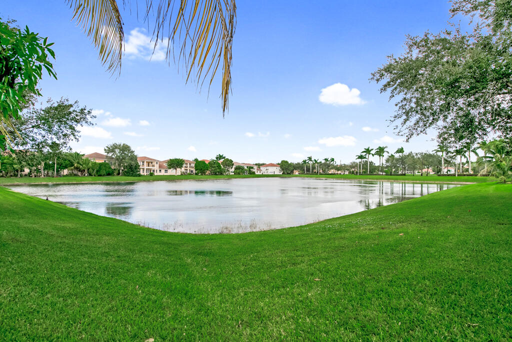 514 Cresta Circle West Palm Beach, FL 33413 - Photo 14 of 74 a view of a lake with a big yard