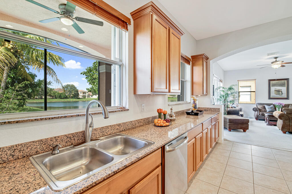 514 Cresta Circle West Palm Beach, FL 33413 - Photo 23 of 74 a kitchen filled a sink a counter and cabinets