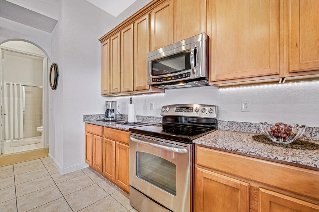 514 Cresta Circle West Palm Beach, FL 33413 - Photo 24 of 74 a kitchen with granite countertop a sink and a stove top oven