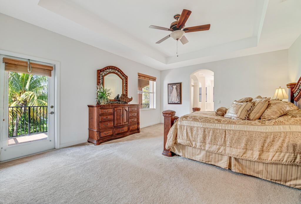 514 Cresta Circle West Palm Beach, FL 33413 - Photo 25 of 74 a spacious bedroom with a bed a dresser and windows