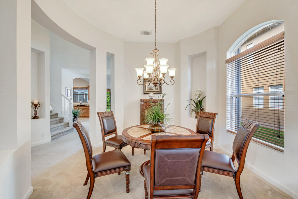 514 Cresta Circle West Palm Beach, FL 33413 - Photo 5 of 74 a dining room with furniture potted plants and wooden floor