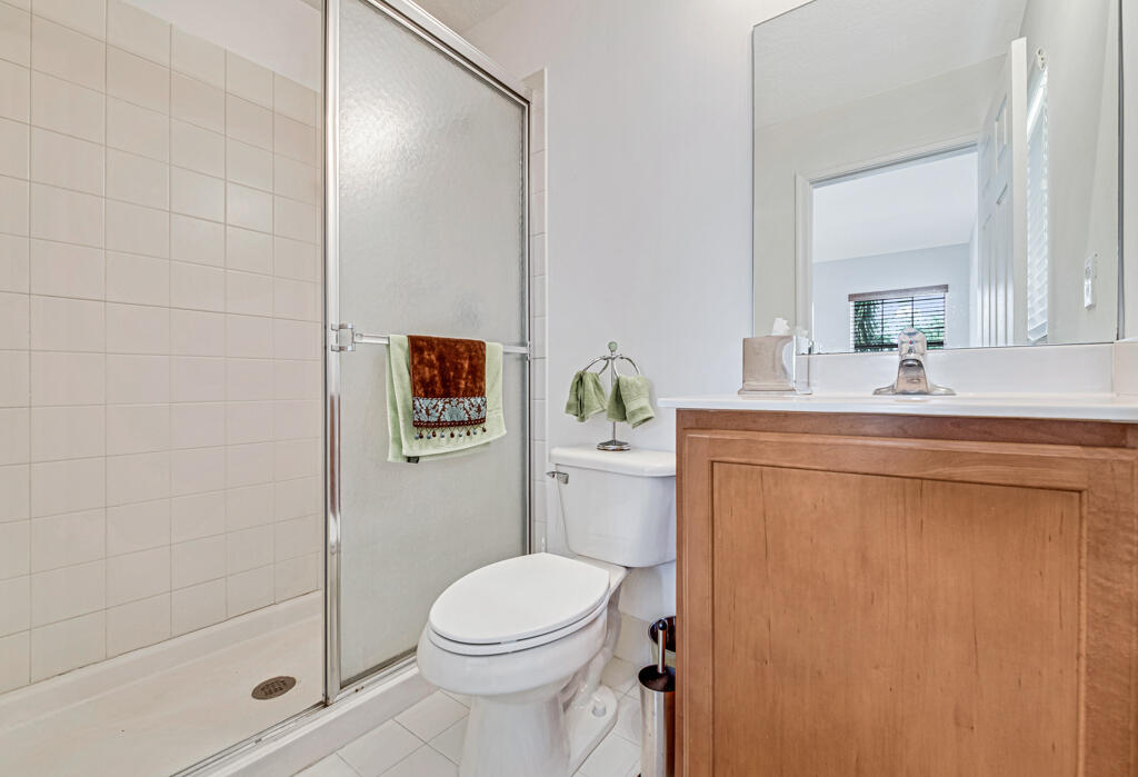514 Cresta Circle West Palm Beach, FL 33413 - Photo 59 of 74 a bathroom with a sink a toilet and shower