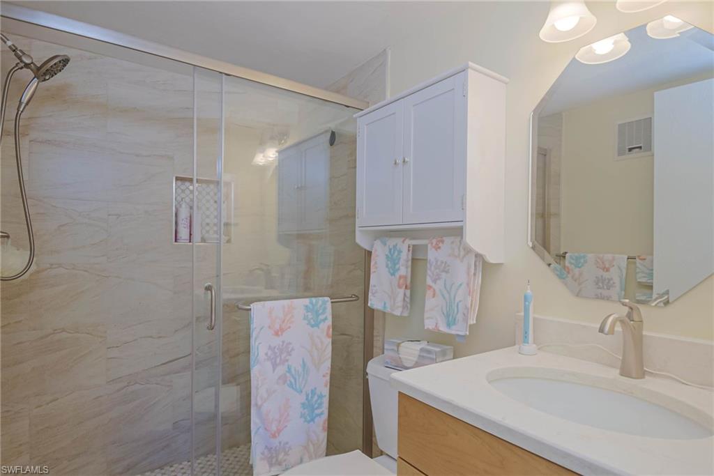 4790 South Cleveland Avenue, Unit 607 Fort Myers, FL 33907 - Photo 16 of 21 a bathroom with a sink and a mirror