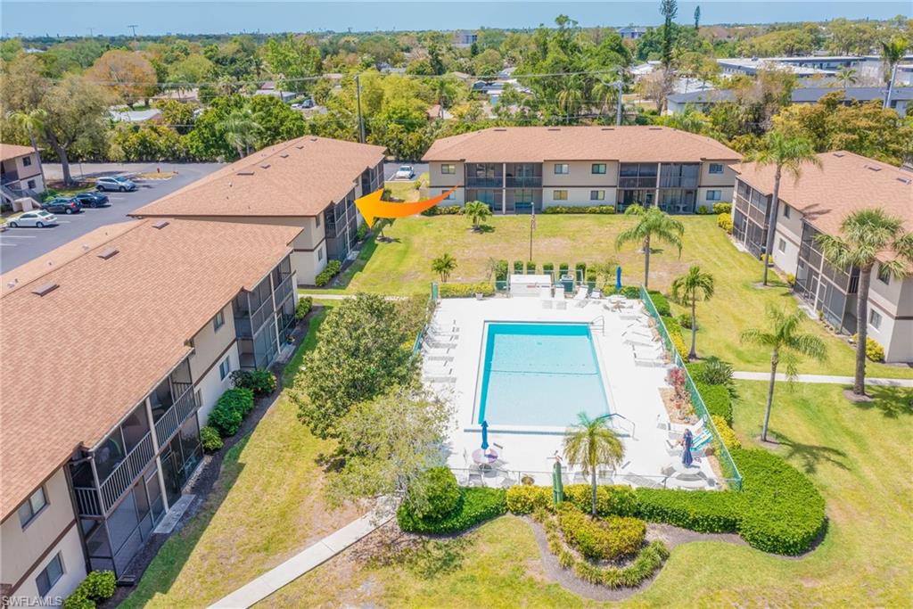 4790 South Cleveland Avenue, Unit 607 Fort Myers, FL 33907 - Photo 21 of 21 a view of a swimming pool with a garden