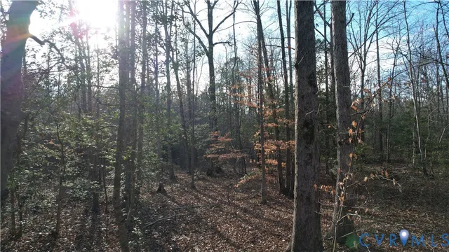 a view of a lake next to a yard