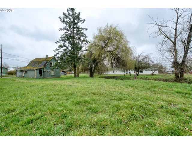 a view of grassy field with benches