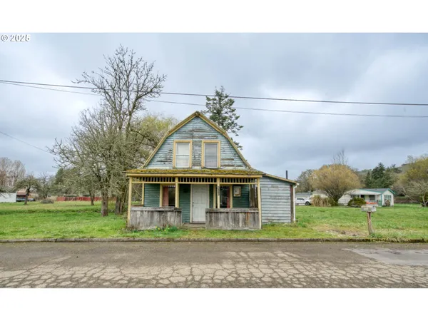 a view of a park with large trees