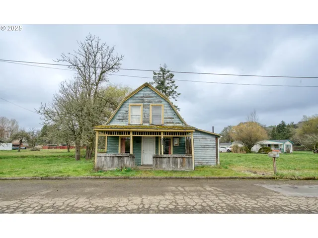a view of a park with large trees