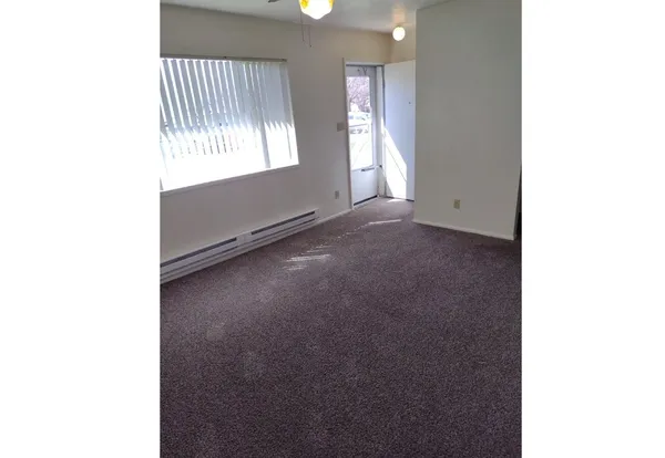 a view of an empty room with a window