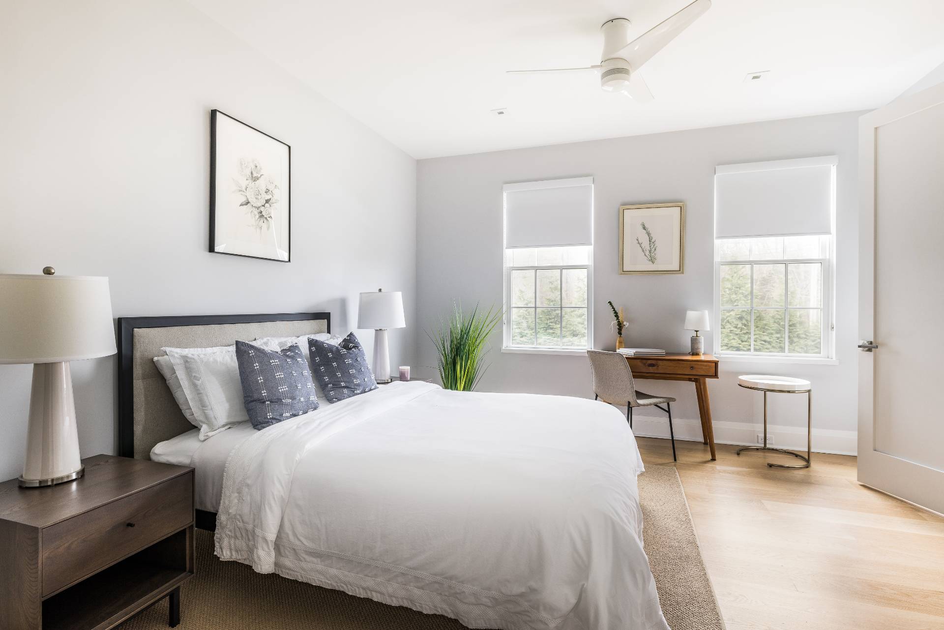 425 Main Street Sag Harbor, NY 11963 - Photo 16 of 26 a bed room with a bed and a table