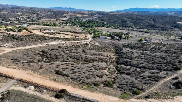 an aerial view of residential house and green space